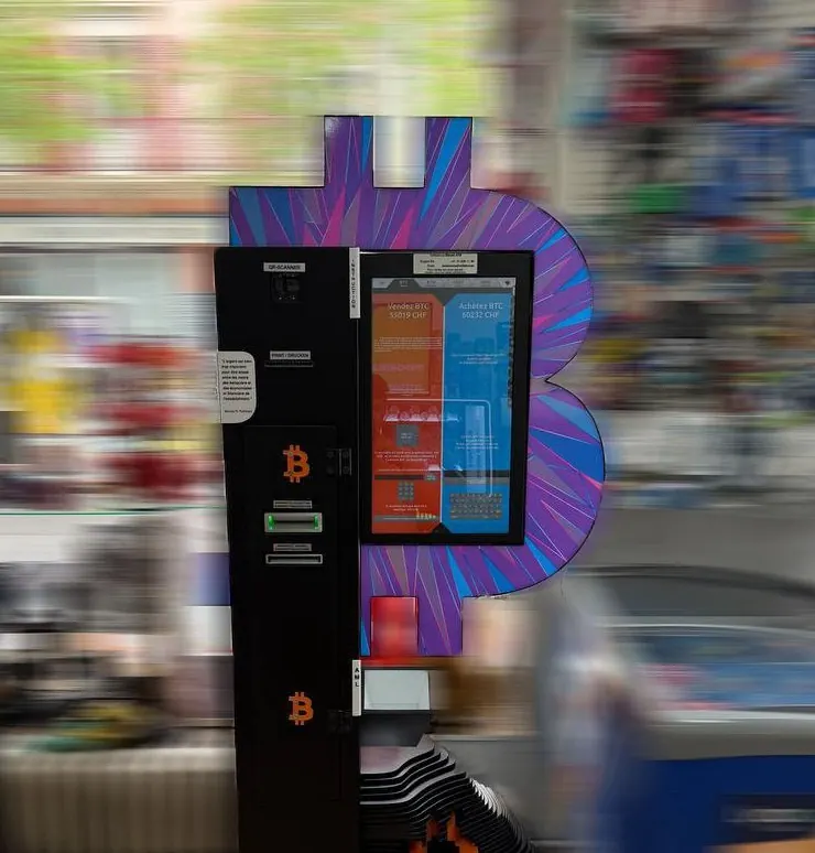 Bitcoin ATM at Av. William-Fraisse 4 in Lausanne with touchscreen and purple Bitcoin backdrop.