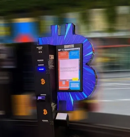 Bitcoin ATM at Friedenstrasse 2 in Lucerne with blue Bitcoin backdrop.