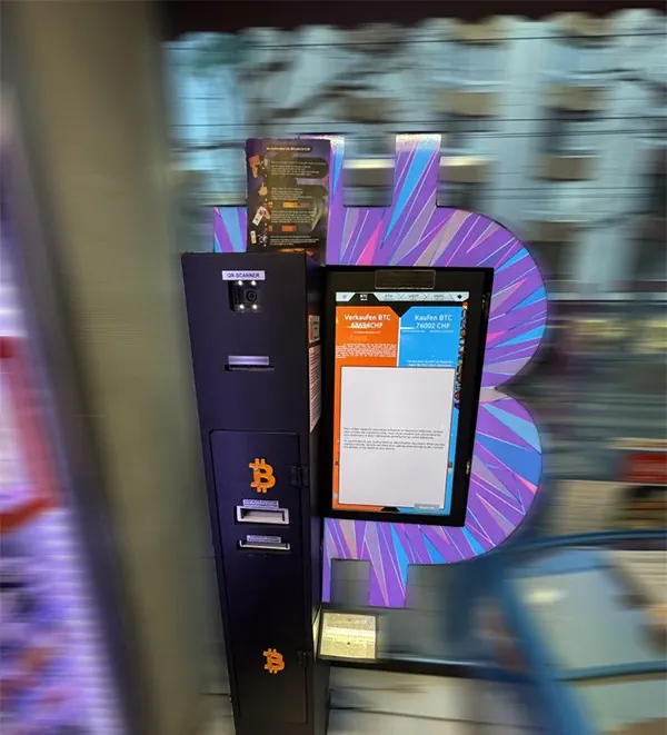 Bitcoin ATM at Seefeldstrasse 178 in Zurich with a purple Bitcoin backdrop.